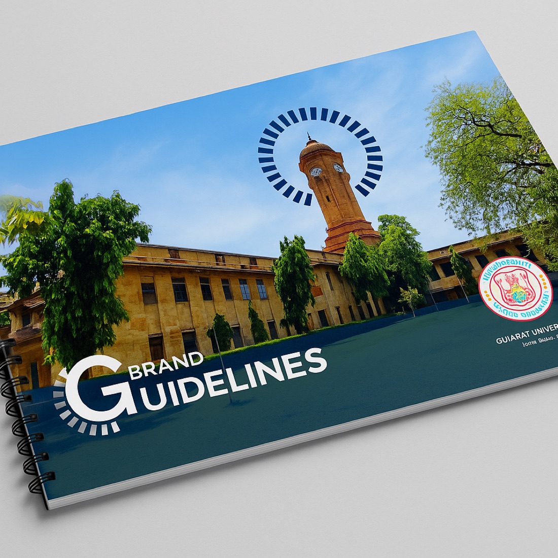 The brand guidelines book cover — historic clock-tower photograph behind the radial brand-device halo and the GUIDELINES wordmark
